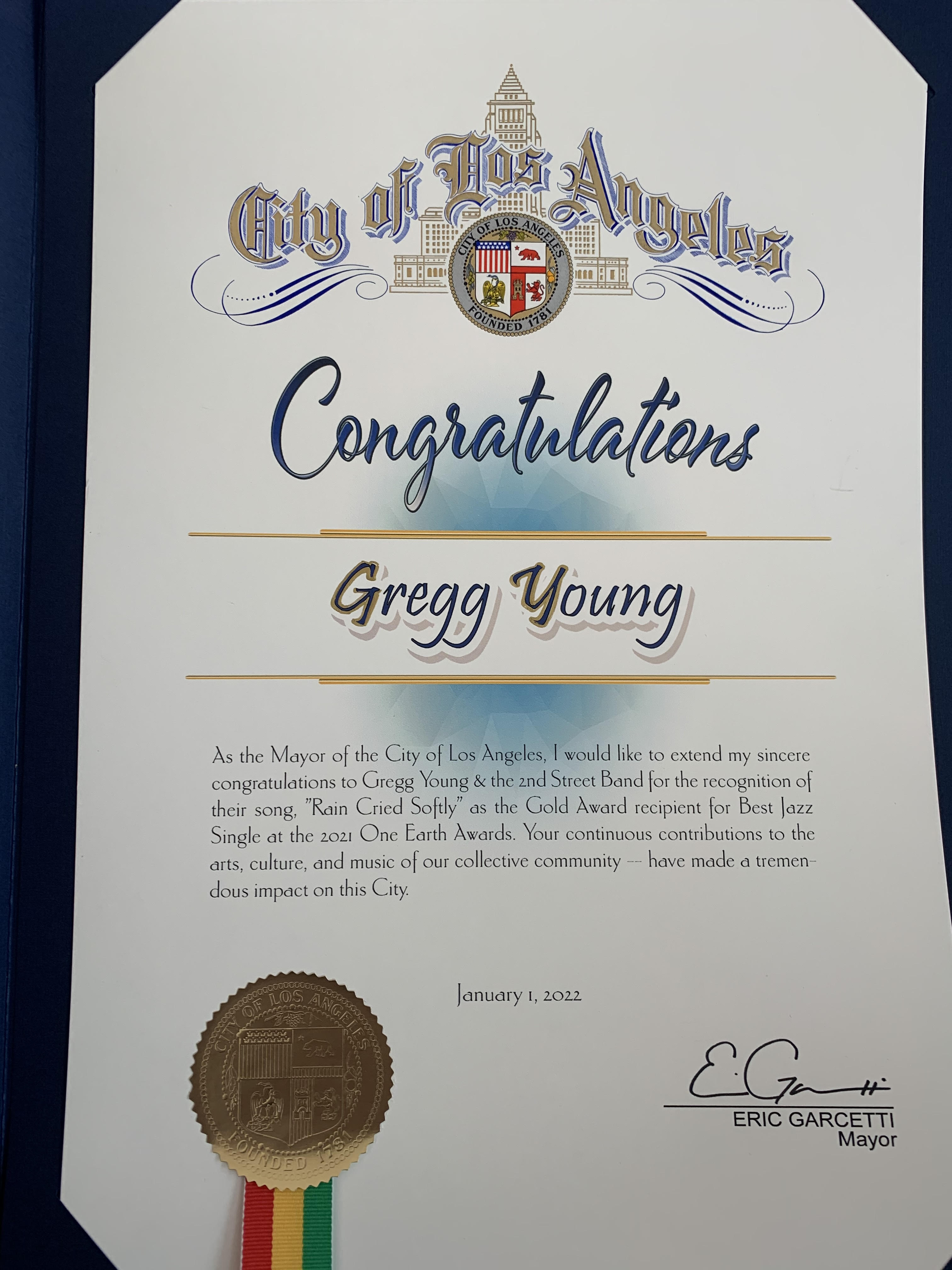 City of Los Angeles certificate awarded to Gregg Young for his recognition of "Rain Cried Softly" signed by Eric Garcetti